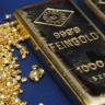 Gold edges lower as investors await fed, US data