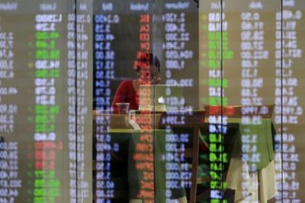 Fed relief lifts Asian stocks, dents dollar