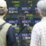 Asian Shares Shudder Under Wall Street's Shadow