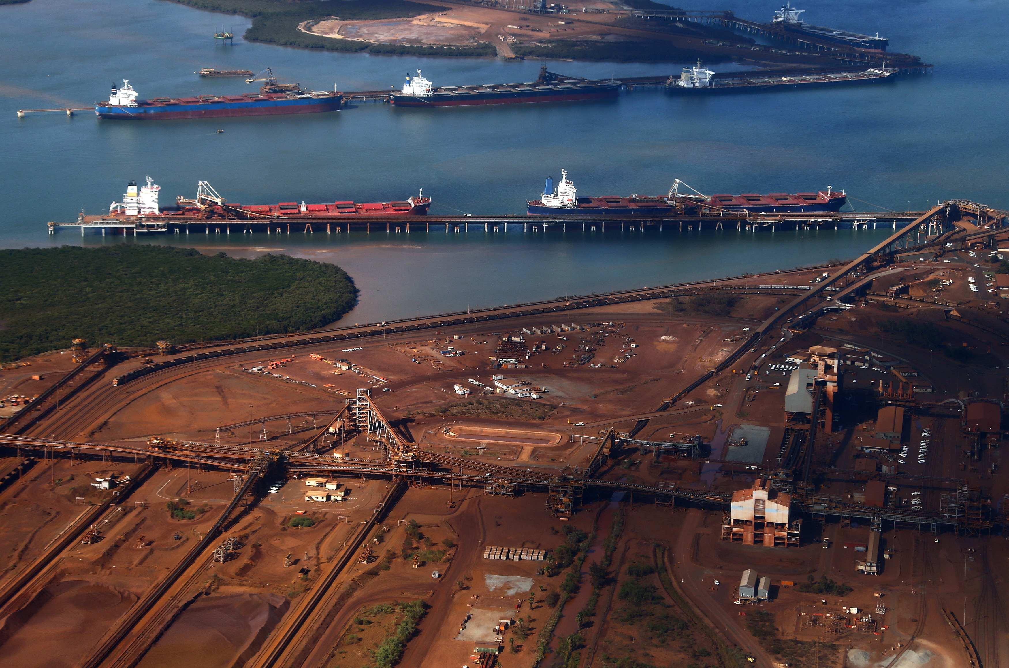 Australia shares seen muted, iron ore price falls